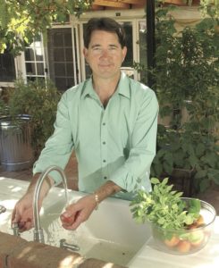Greg at the sink in his backyard